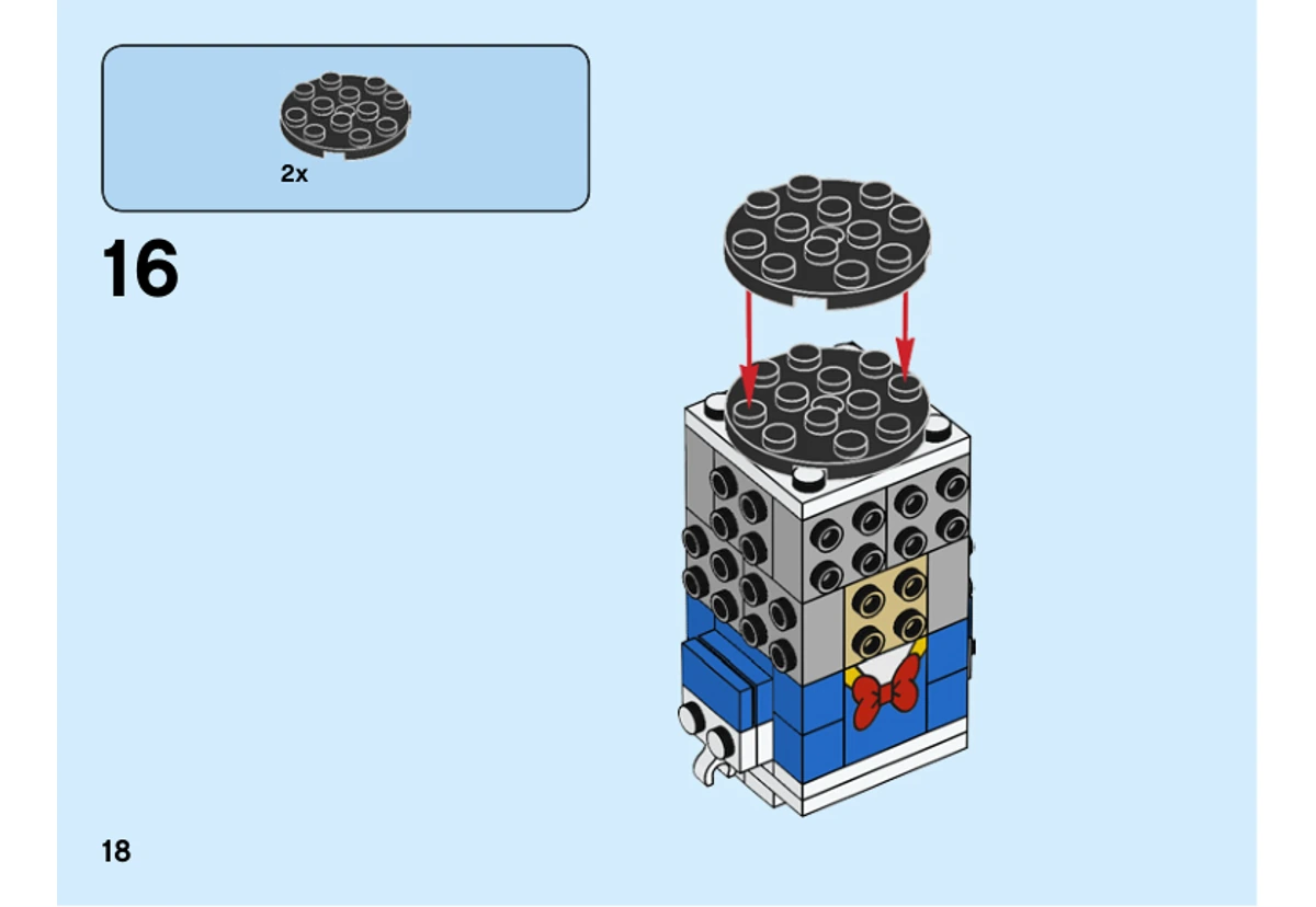 Notice officielle LEGO 40377, page PDF 18, étape 16 : Deux plaques rondes noires sont empilées au sommet de la tête encore ouverte.