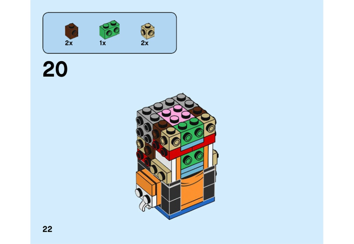 Notice officielle LEGO 40378, page PDF 22, étape 20 : Des briques brunes, vertes et beiges complètent le noyau visible de la tête avant les faces.