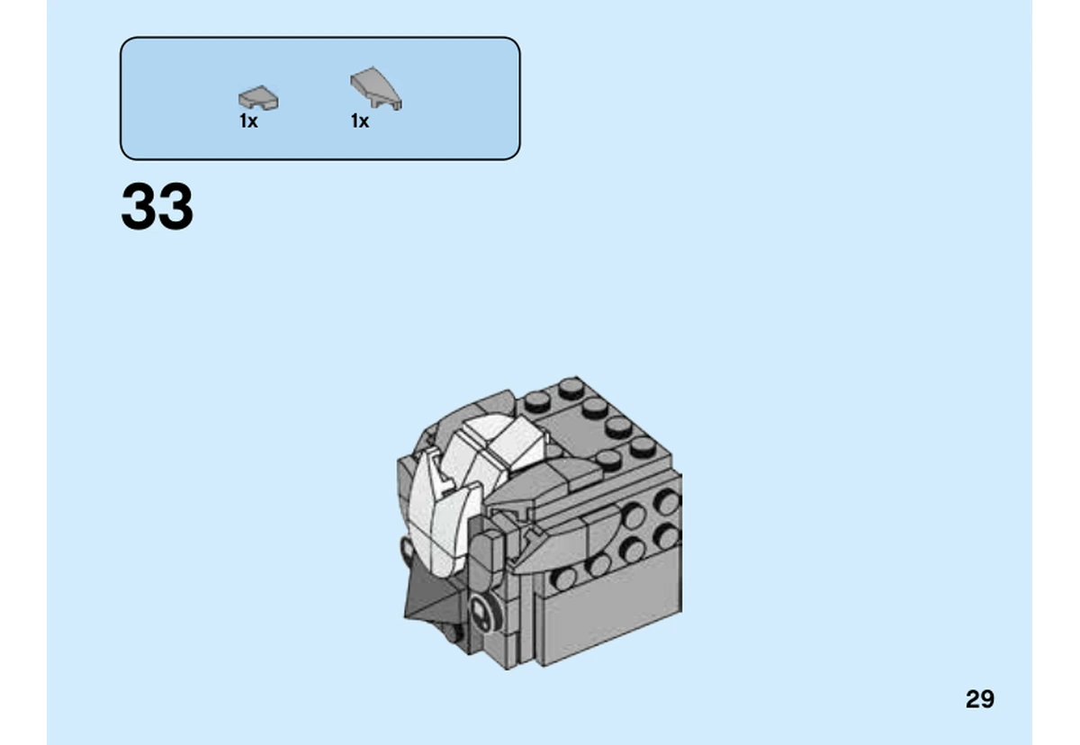 Notice LEGO 40412, livret 6324676, page 29, étape 33 : La pente grise forme le bec à l’avant de la tête, entre les deux yeux imprimés.