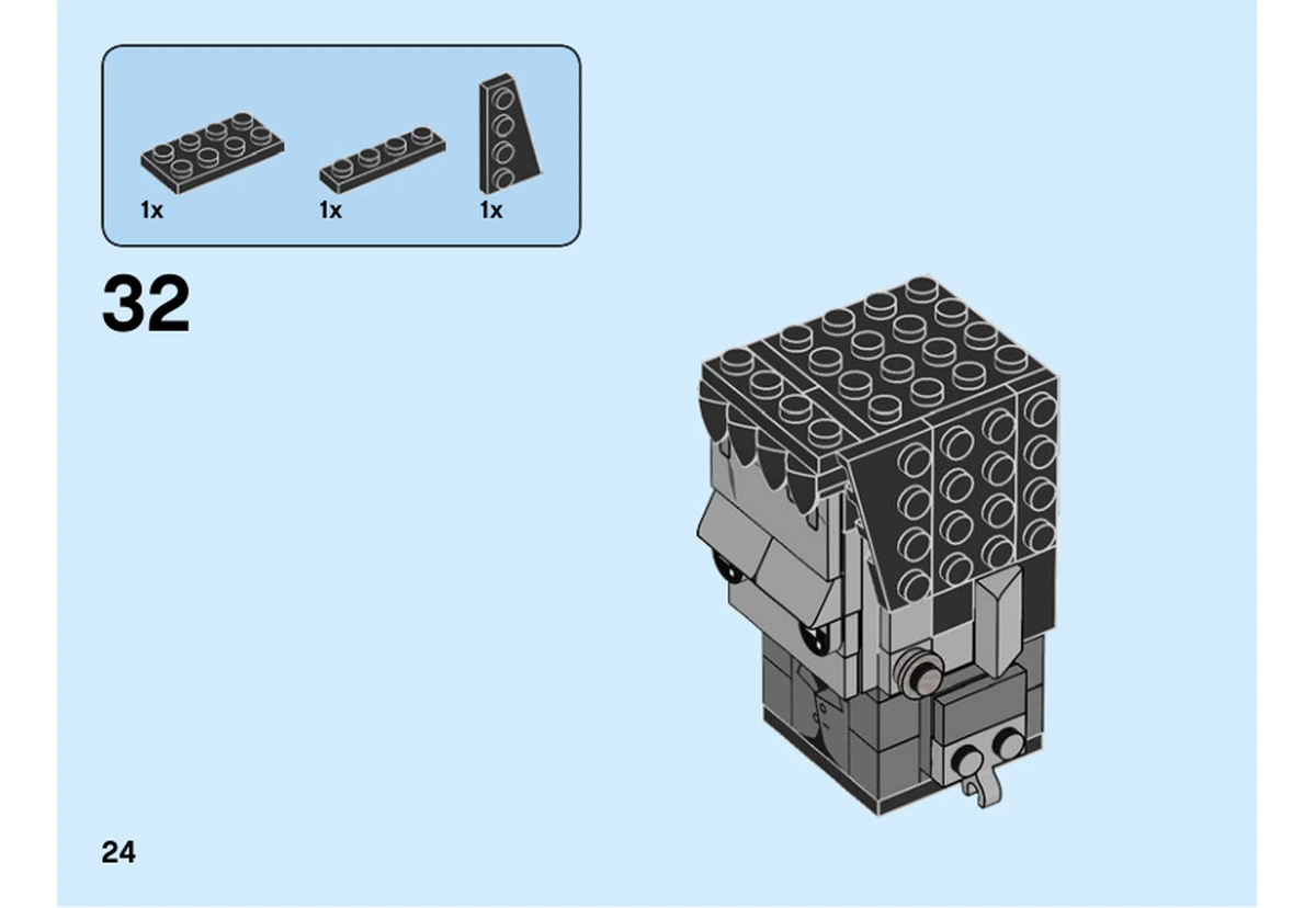 Notice LEGO 40422, livret 6328449, page 24, étape 32 : Des plaques noires, dont une grande plaque biseautée, recouvrent un côté de la tête.