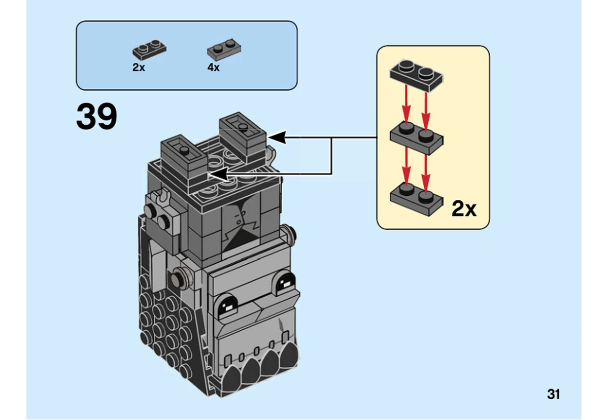 Notice LEGO 40422, livret 6328449, page 31, étape 39 : Après retournement, deux petits sous-ensembles noirs et gris composent les jambes sous le corps.