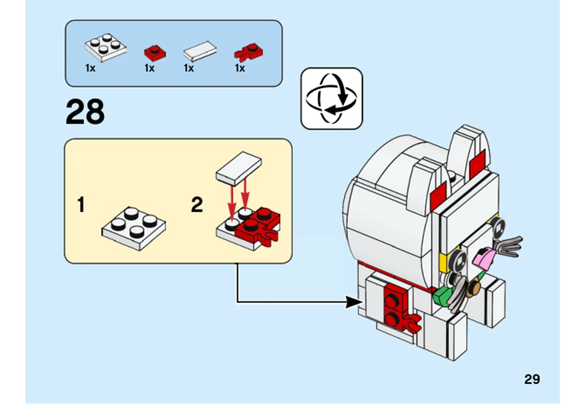 Notice officielle LEGO 40436, livret 6309020, page 29, étape 28 : Après retournement, le petit sous-assemblage blanc et rouge est fixé au raccord latéral du corps. La plaque dorée est ajoutée à l’étape suivante.