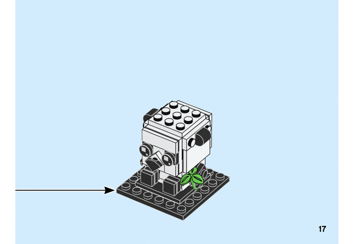 Notice officielle LEGO 40466, livret 6351442, page 17, étape fin du premier bébé : Le premier petit panda, avec son bambou, est placé sur son socle noir.
