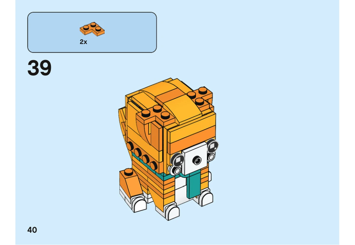 Notice officielle LEGO 40480, livret 6372358, page 40, étape 39 : Deux plaques orange à barrette complètent le sommet de la tête ; les yeux et le collier turquoise sont déjà installés.
