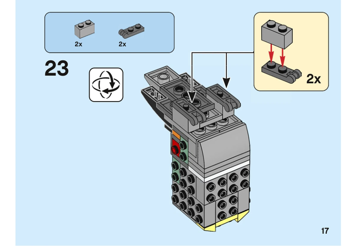 Notice officielle LEGO 40481, livret 6372362, page 17, étape 23 : Après retournement, deux petits assemblages gris associent une brique et une plaque avant leur pose sous le corps.