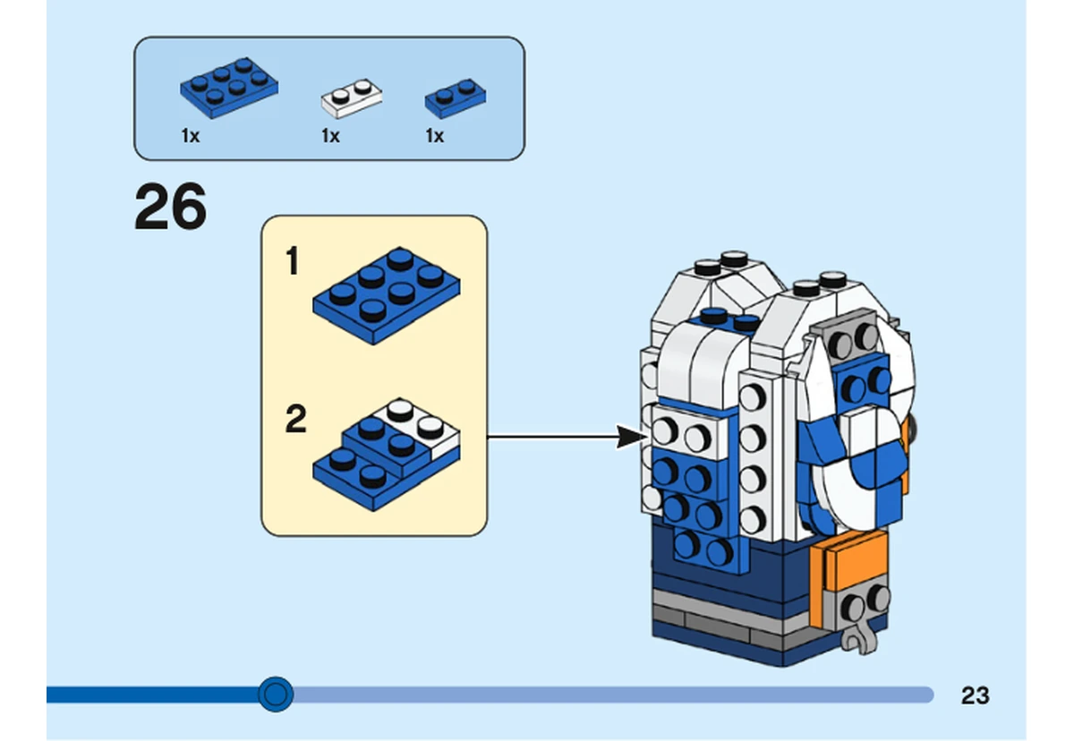 Notice officielle LEGO 40539, livret 6400828, page 23, étape 26 : Des plaques bleues et une petite plaque blanche forment une bande fixée à l’arrière de la tête, dans l’habillage rayé.