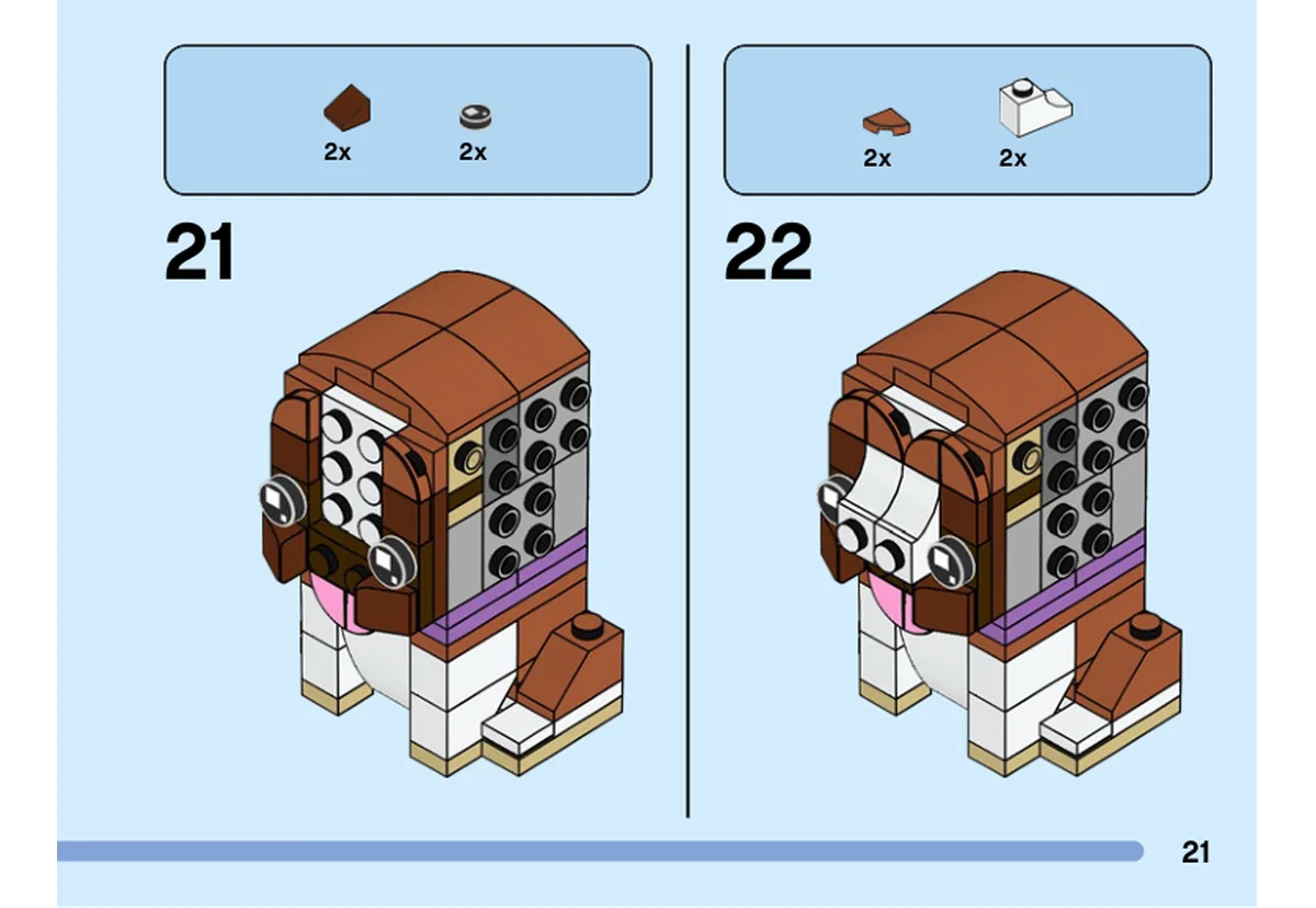 Notice officielle LEGO 40543, livret 6399600, page 21, étape 21 et 22 : L’étape 21 fixe deux yeux noirs et deux petites pièces brunes sur la face. L’étape 22 ajoute deux quarts de cercle bruns et deux courbes blanches au museau.