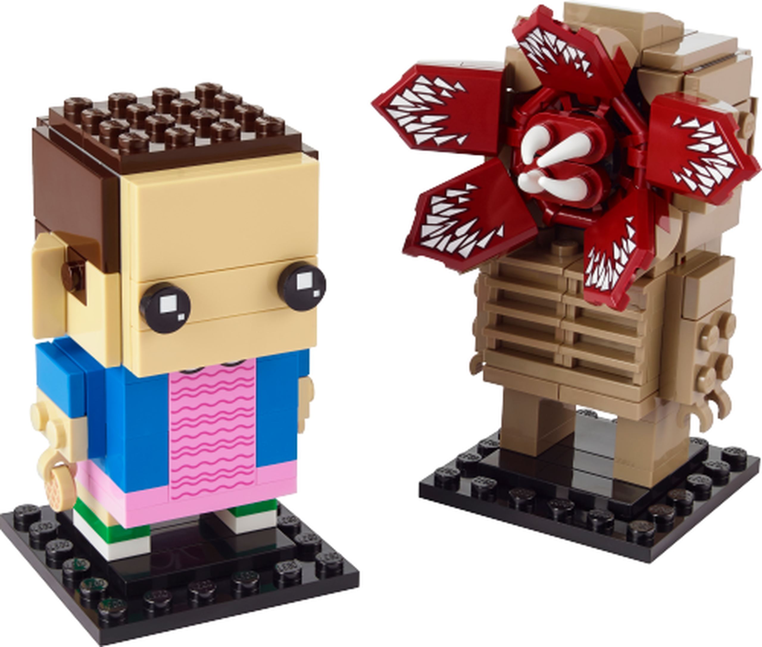 Modèle officiel LEGO 40549 : Demogorgon et Onze. Onze combine cheveux bruns courts, veste bleue, robe rose imprimée et une gaufre. Le Demogorgon beige foncé présente une tête ouverte à cinq pétales rouge foncé imprimés de dents et des crocs blancs centraux.