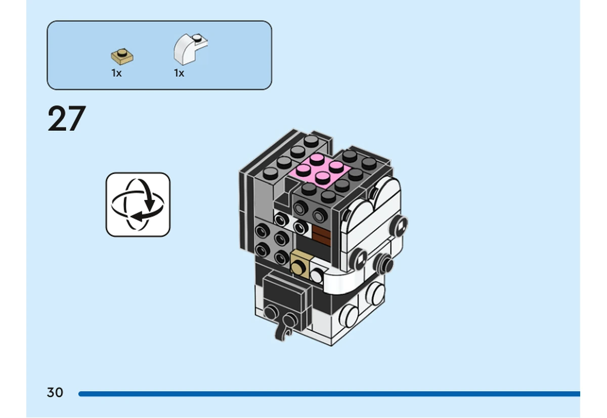 Notice officielle LEGO 40622, livret 6467951, page 30, étape 27 : Après la vue retournée, une petite plaque beige et un élément blanc incurvé complètent le côté de la tête. Le noyau rose est déjà en place.