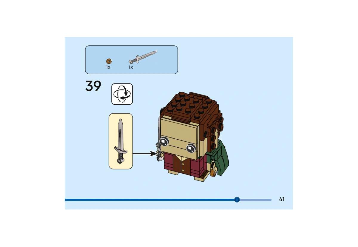 Notice officielle LEGO 40630, livret 6449469, page 41, étape 39 : L’encadré de l’étape contient un anneau et une épée. La flèche montre la pose de l’épée dans une main ; l’anneau apparaît dans l’autre main sur la vue du personnage.
