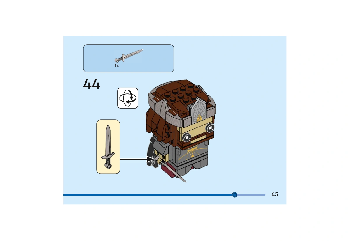 Notice officielle LEGO 40632, livret 6449480, page 45, étape 44 : Après rotation du personnage coiffé de sa couronne, l’épée argentée est fixée dans sa main.