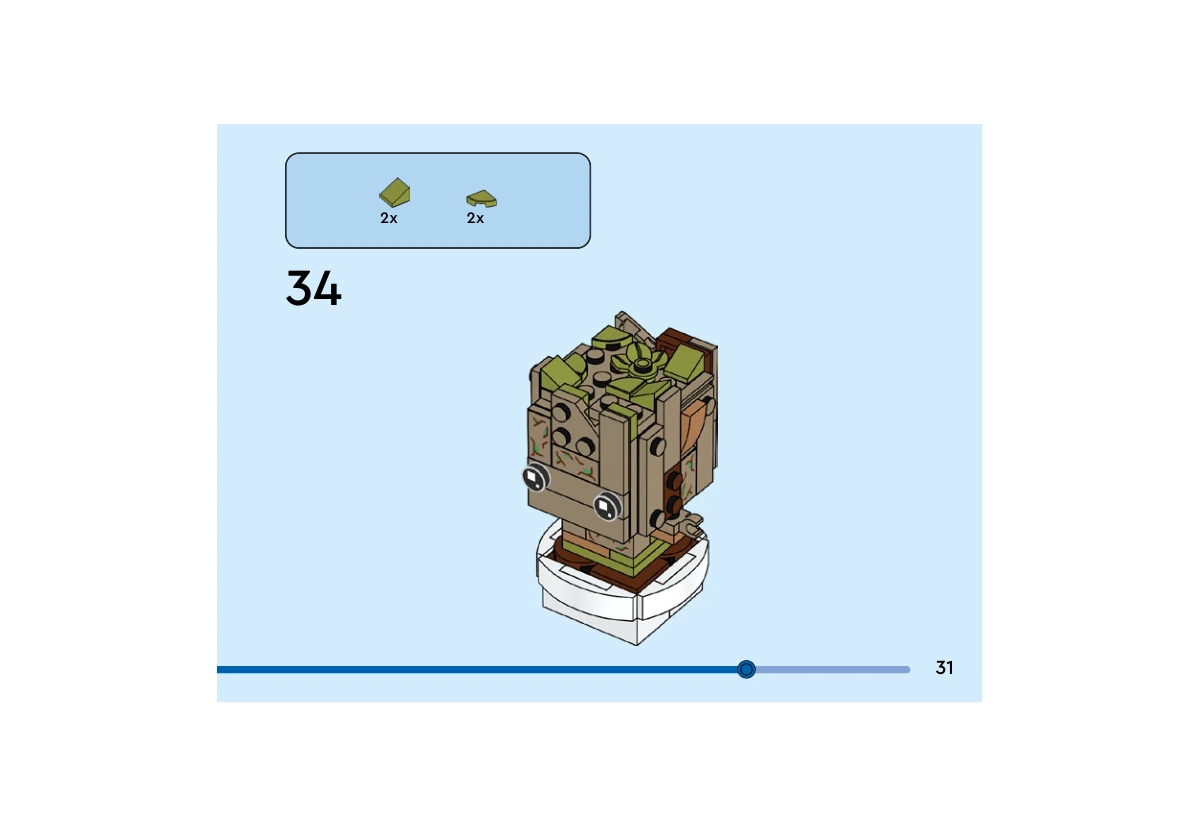 Notice officielle LEGO 40671, livret 6499331, page 31, étape 34 : Deux petites pentes et deux tuiles en quart de cercle vert olive complètent le relief végétal sur le dessus de la tête déjà habillée.