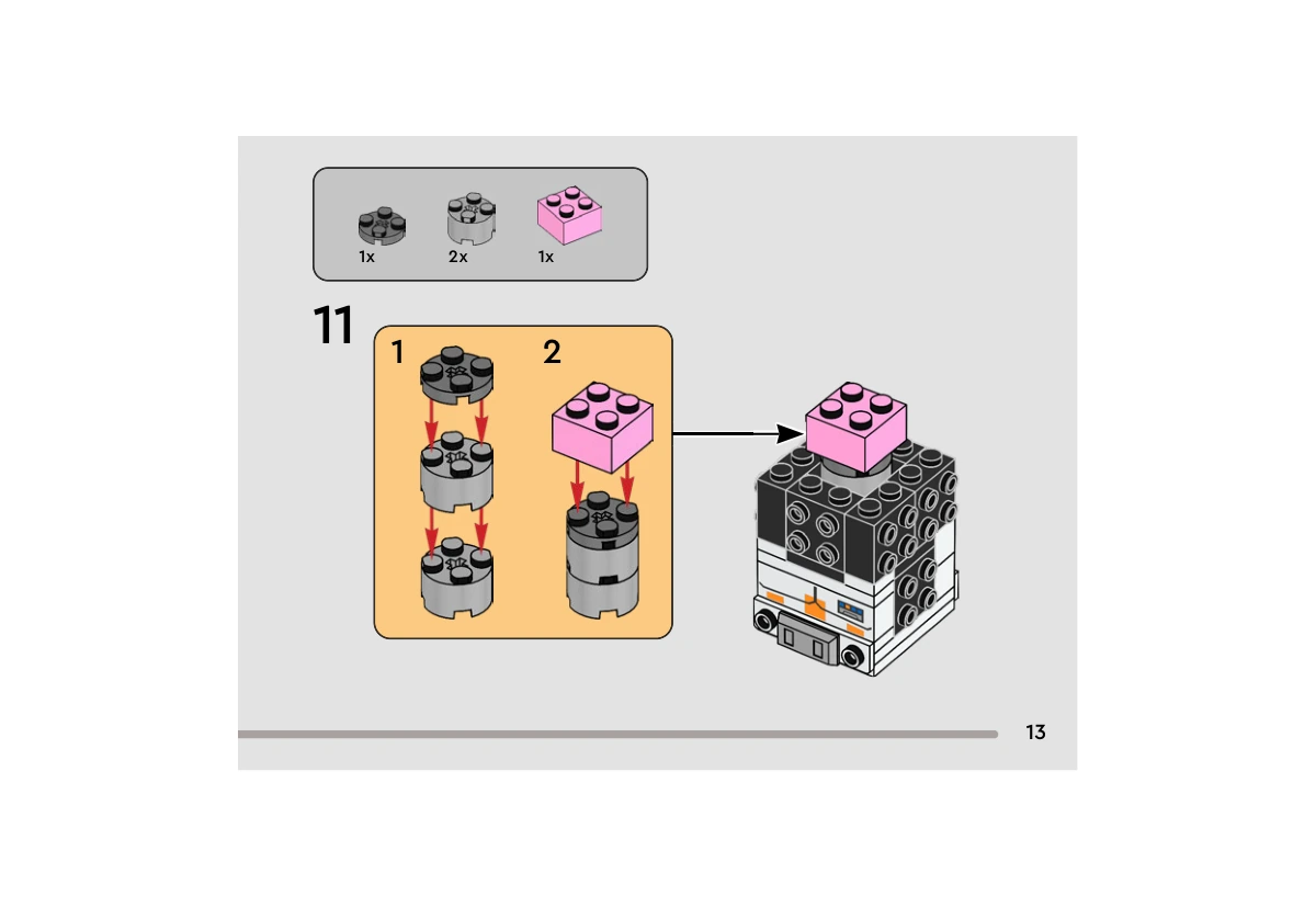Notice officielle LEGO 40675, livret 6513190, page 13, étape 11 : Une plaque ronde gris foncé s’ajoute sur deux briques rondes gris clair. Une brique rose 2 × 2 complète l’empilement, ensuite placé dans le noyau noir encore ouvert au-dessus du torse imprimé.