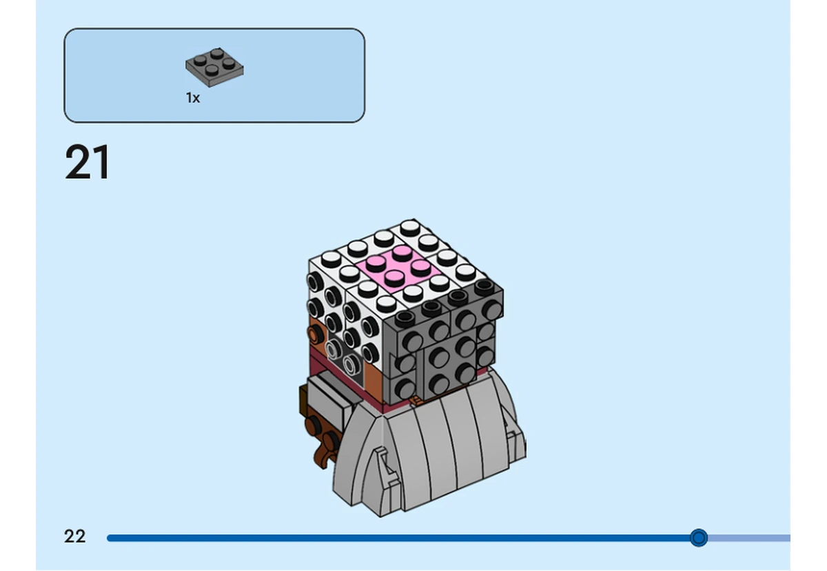 Notice officielle LEGO 40751, livret 6521397, page 22, étape 21 : Une plaque gris foncé 2 × 2 recouvre un bord supérieur du noyau de tête ; la brique rose centrale reste visible.