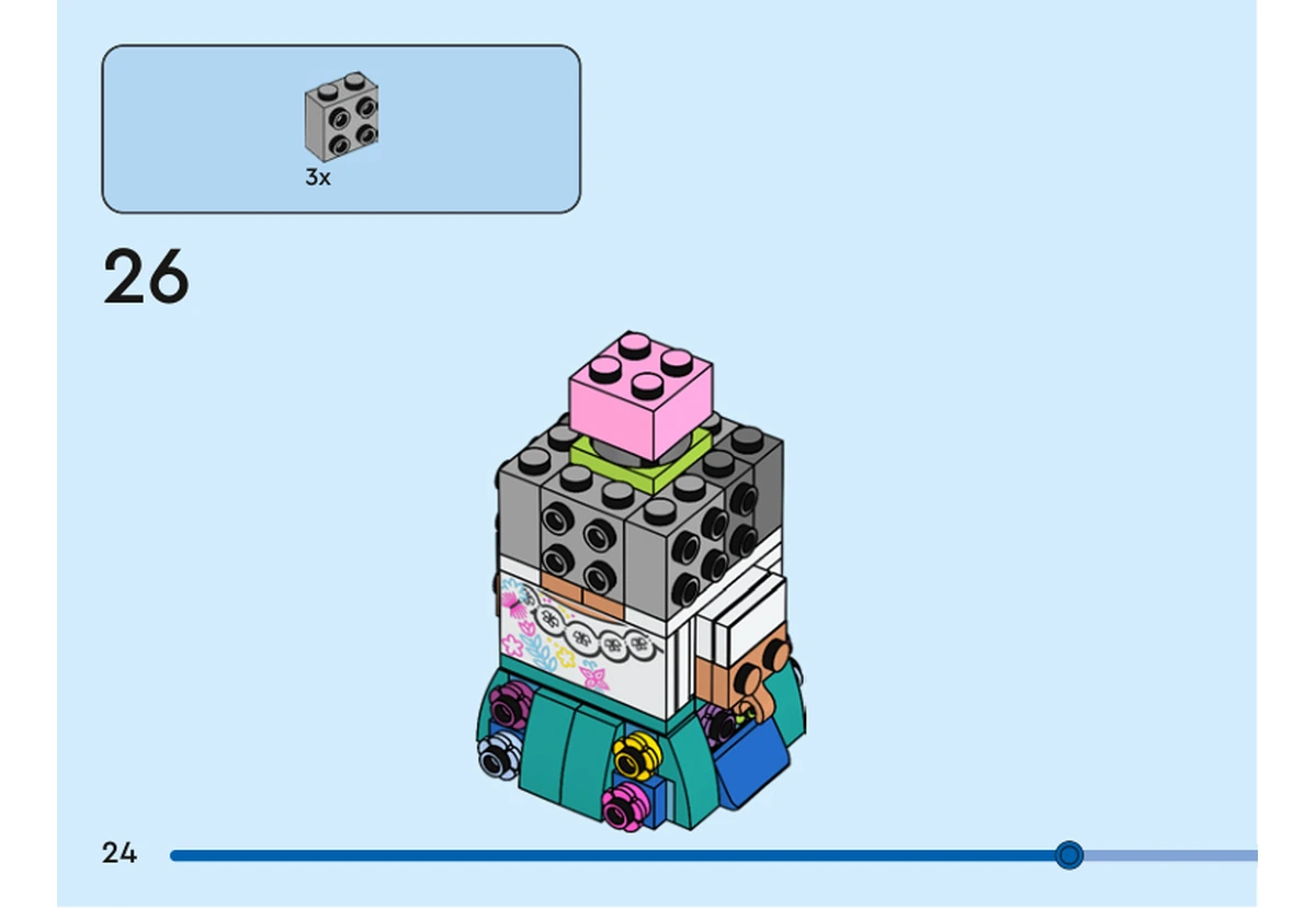 Notice officielle LEGO 40753, livret 6521382, page 24, étape 26 : Trois supports gris à tenons latéraux entourent le noyau de tête. La brique rose déjà installée reste visible au-dessus.