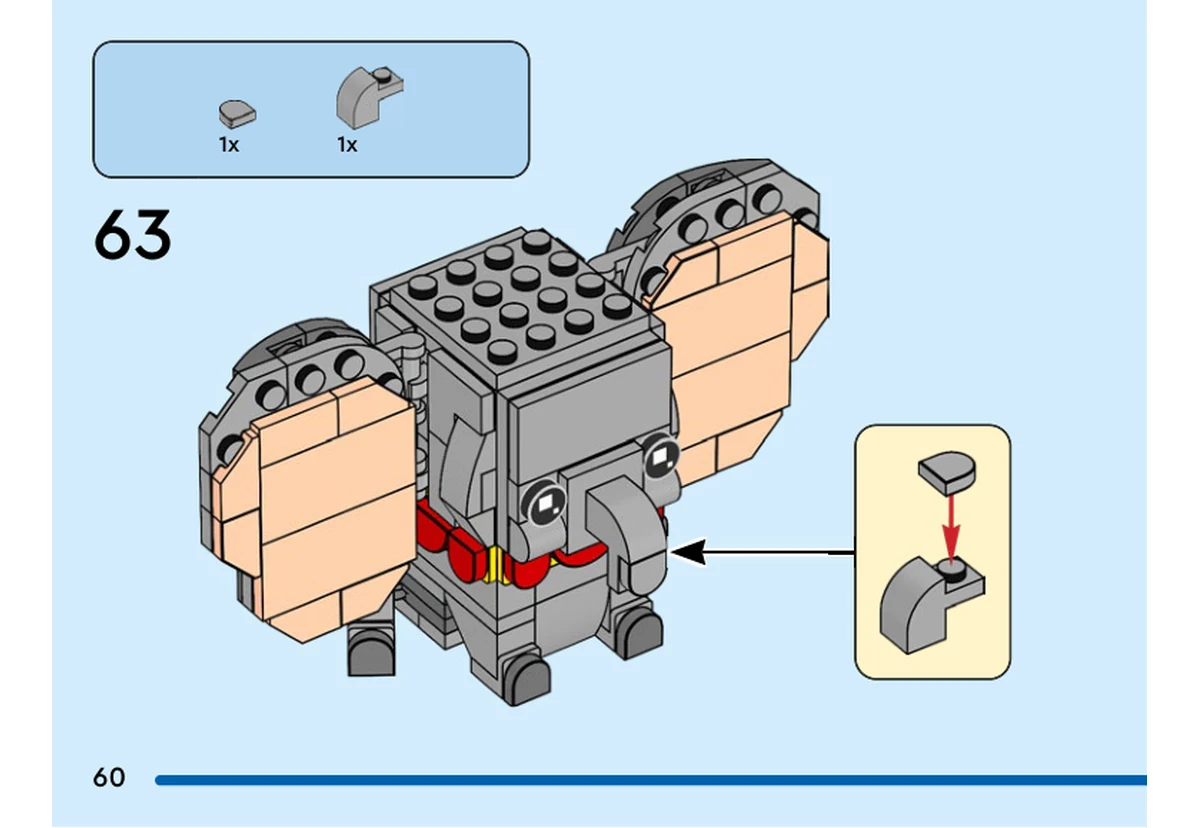Notice officielle LEGO 40792, livret 6561697, page 60, étape 63 : Une petite tuile grise en demi-cercle rejoint une pièce grise incurvée. Le petit sous-ensemble est fixé au bout de la trompe, sous les yeux déjà installés.