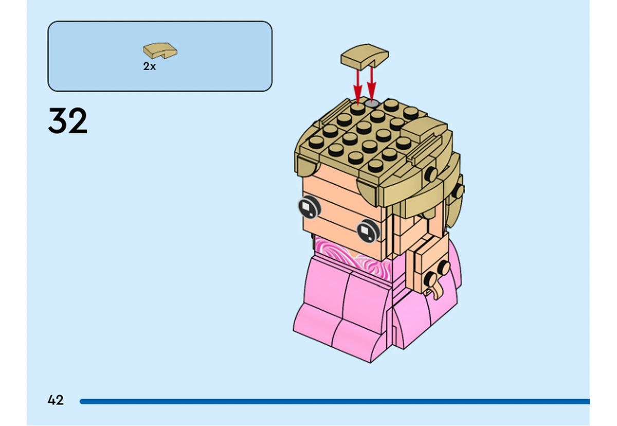 Notice officielle LEGO 40794, livret 6592653, page 42, étape 32 : Deux petites pentes incurvées beiges sont posées sur le sommet des cheveux. Le visage et les yeux sont déjà installés.
